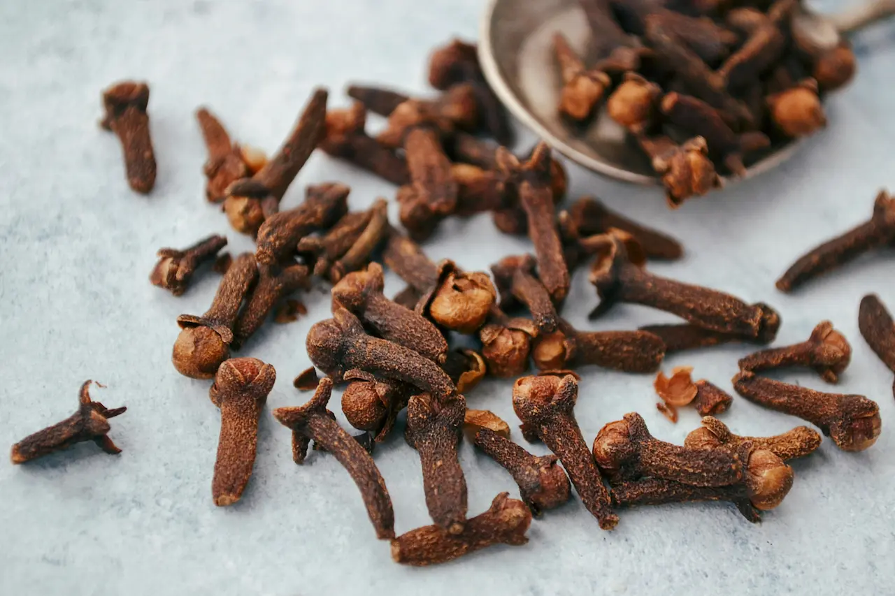 Scattered cloves across the kitchen counter, ready for their next recipe.